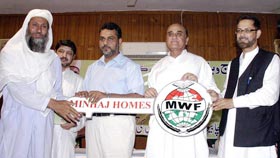 MWF distributes keys of houses & cheques among Flood victims