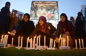 PAT (women wing) holds candle vigil for martyrs of armed forces